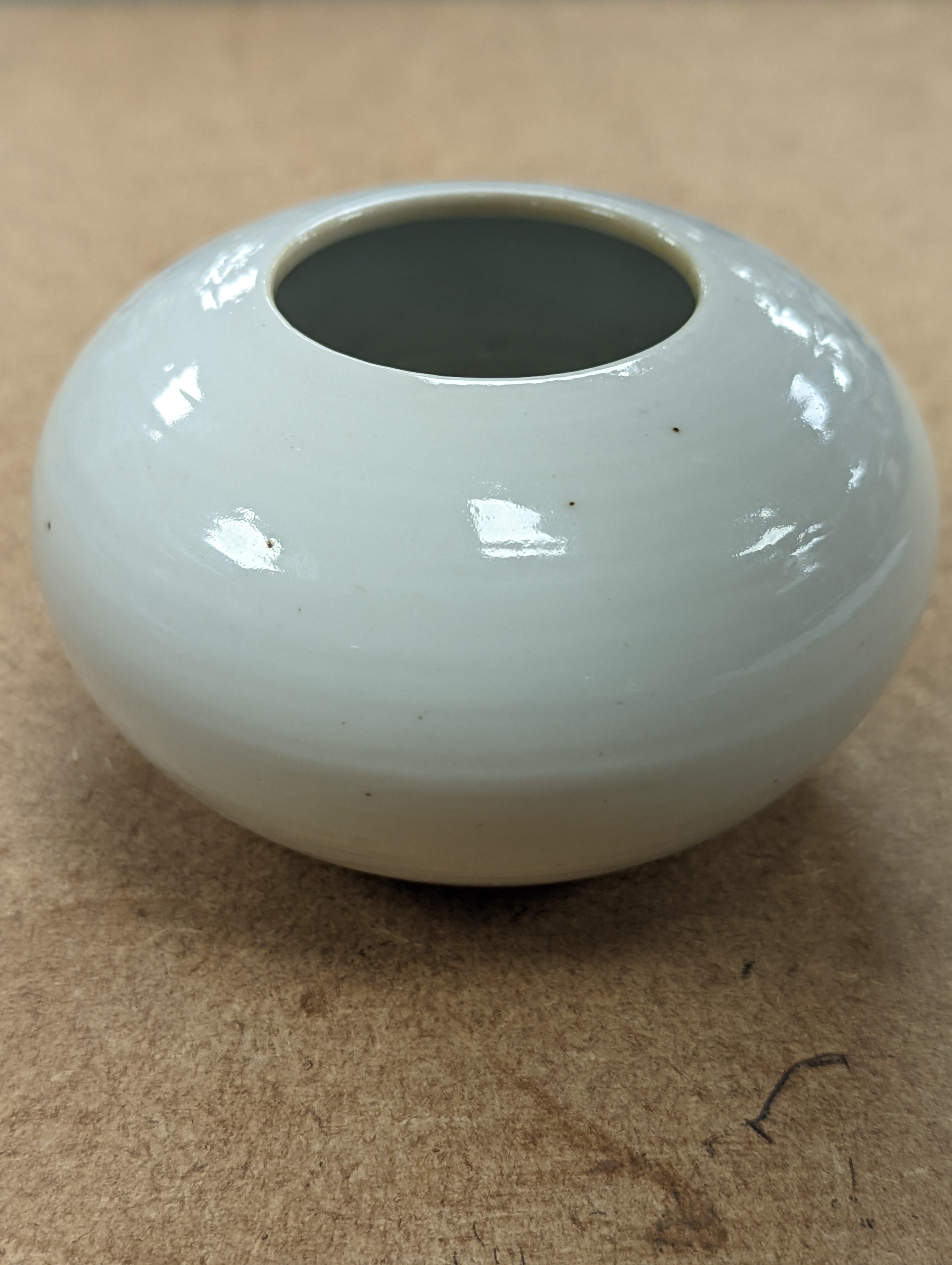 A Chinese white glazed water pot and a similar cup (2)